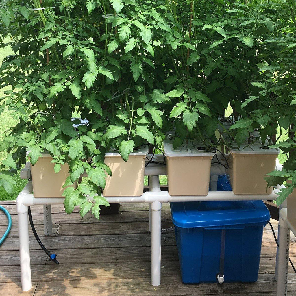 Automated watering with top irrigation using hydroponic irrigation emitter and drippers